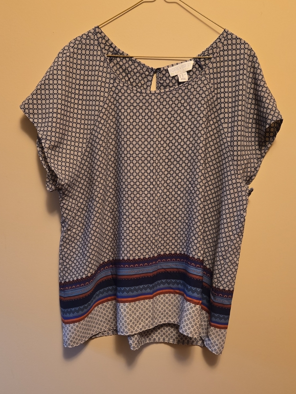 Geometric Short Sleeve Blouse with Multi-Striped Hem